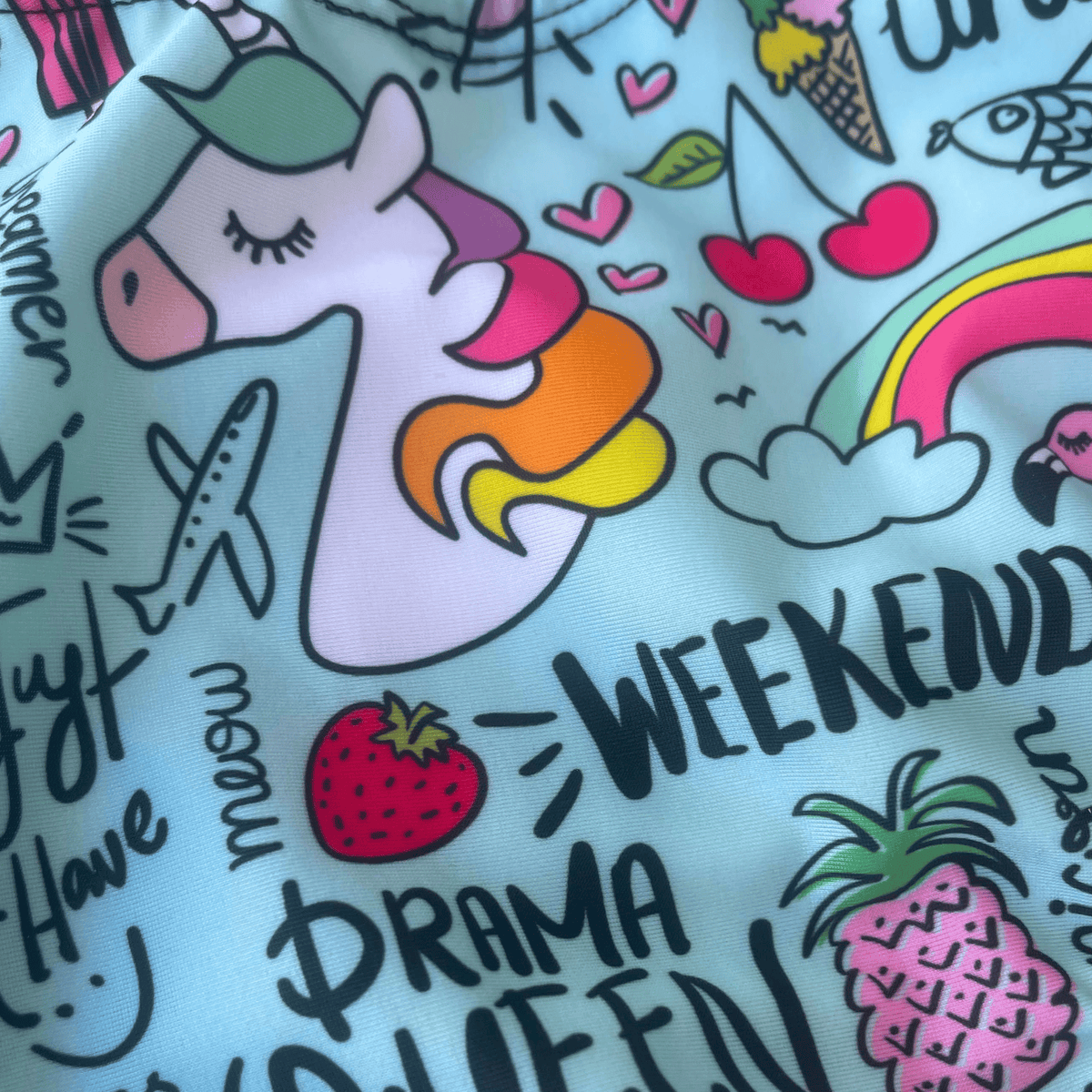 Kikx Extra Life Fastback Swimsuit in Unicorn and Summer Theme on Aqua Green