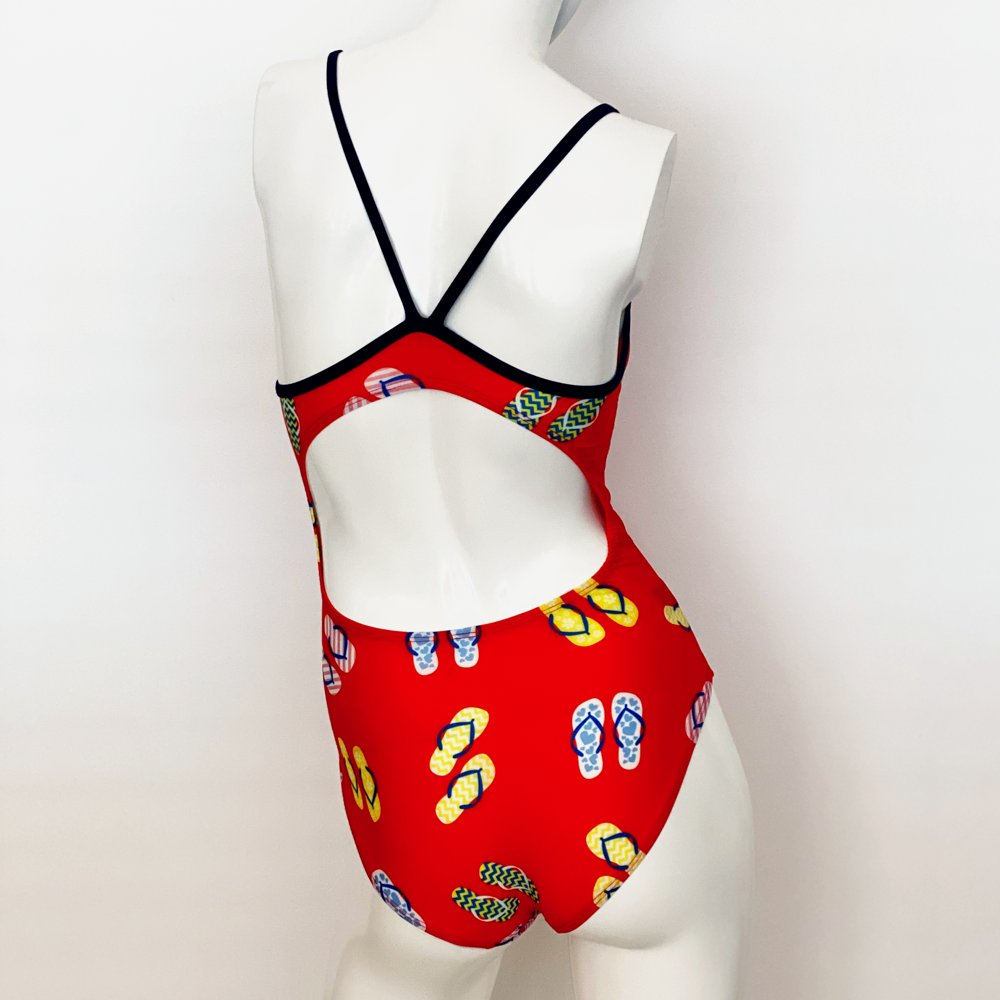 Kikx Extra Life Thin Strap Swimsuit in Slip Slops on Coral with Black Straps