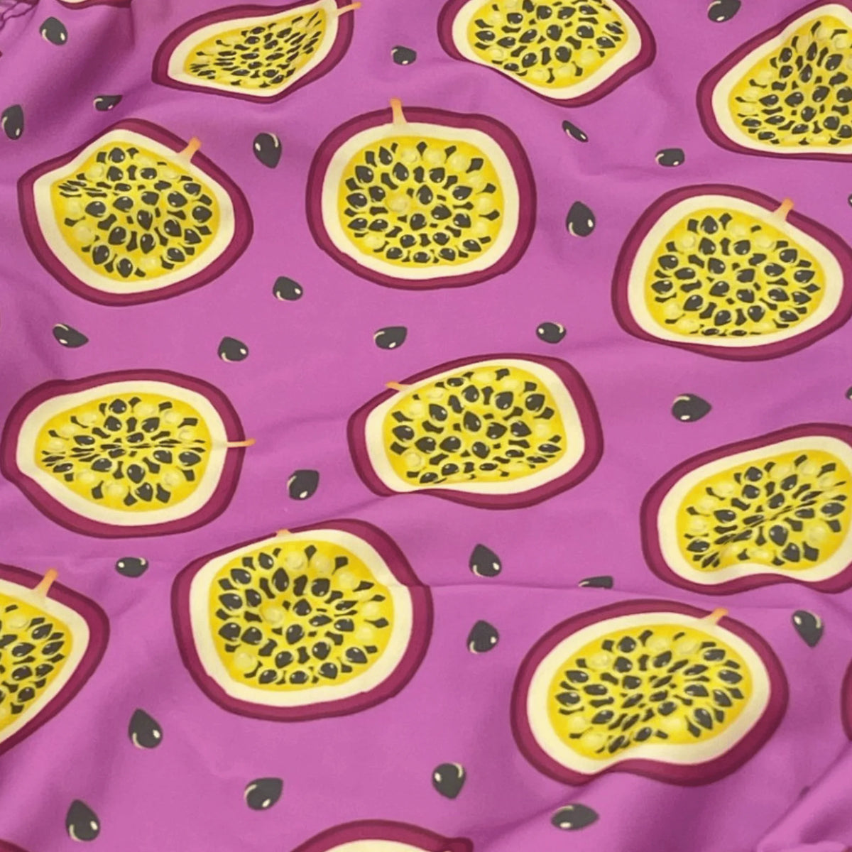 Kikx Extra Life Fastback Swimsuit in Passion Fruit on Light Purple Background
